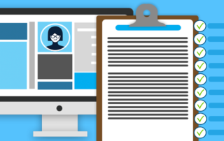 Computer next to clipboard with checklist