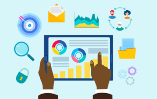 Person's hands holding tablet covered in charts