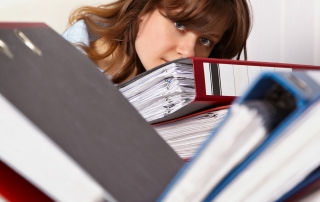 Woman buried behind binders